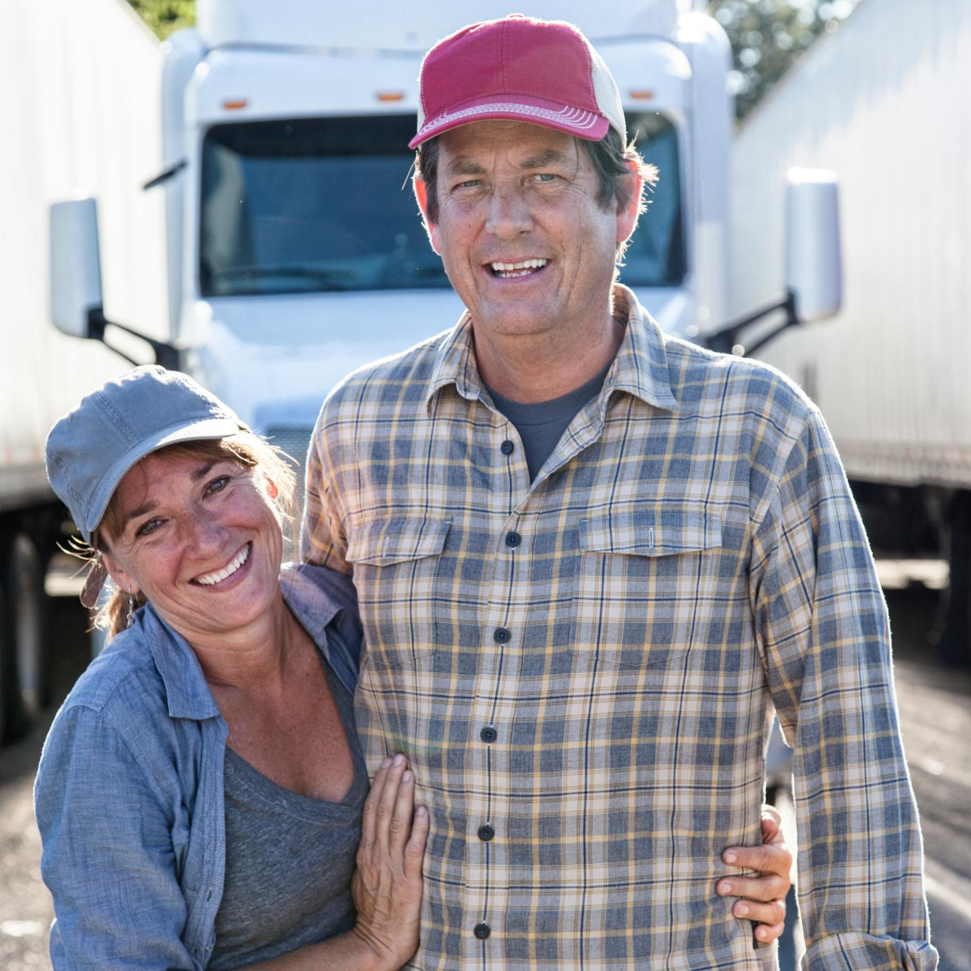 husband-and-wife-driving-team-in-front-of-their-co-2025-04-03-22-26-43-square