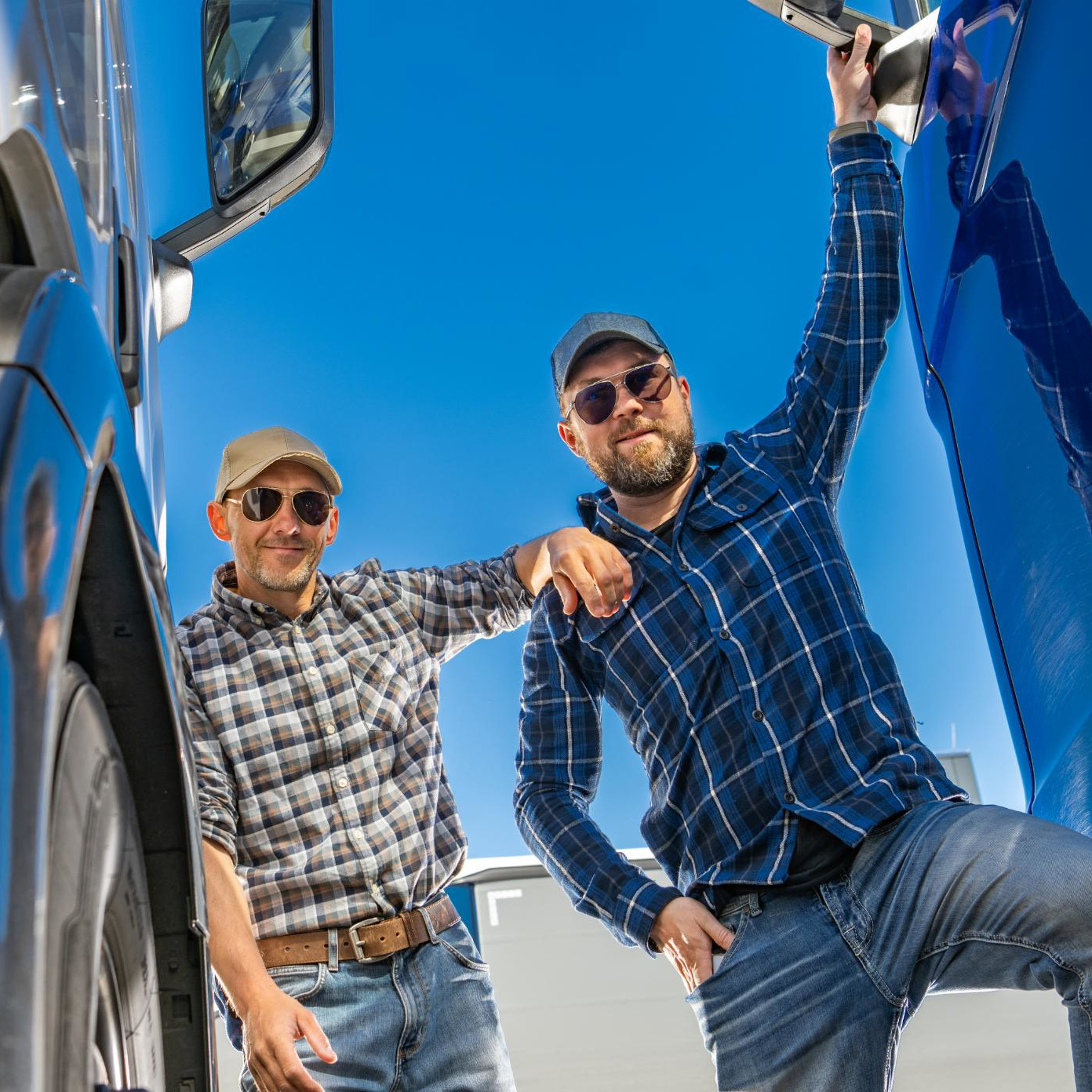 two-happy-caucasian-semi-truck-driver-enjoying-the-2025-03-15-07-08-51-square