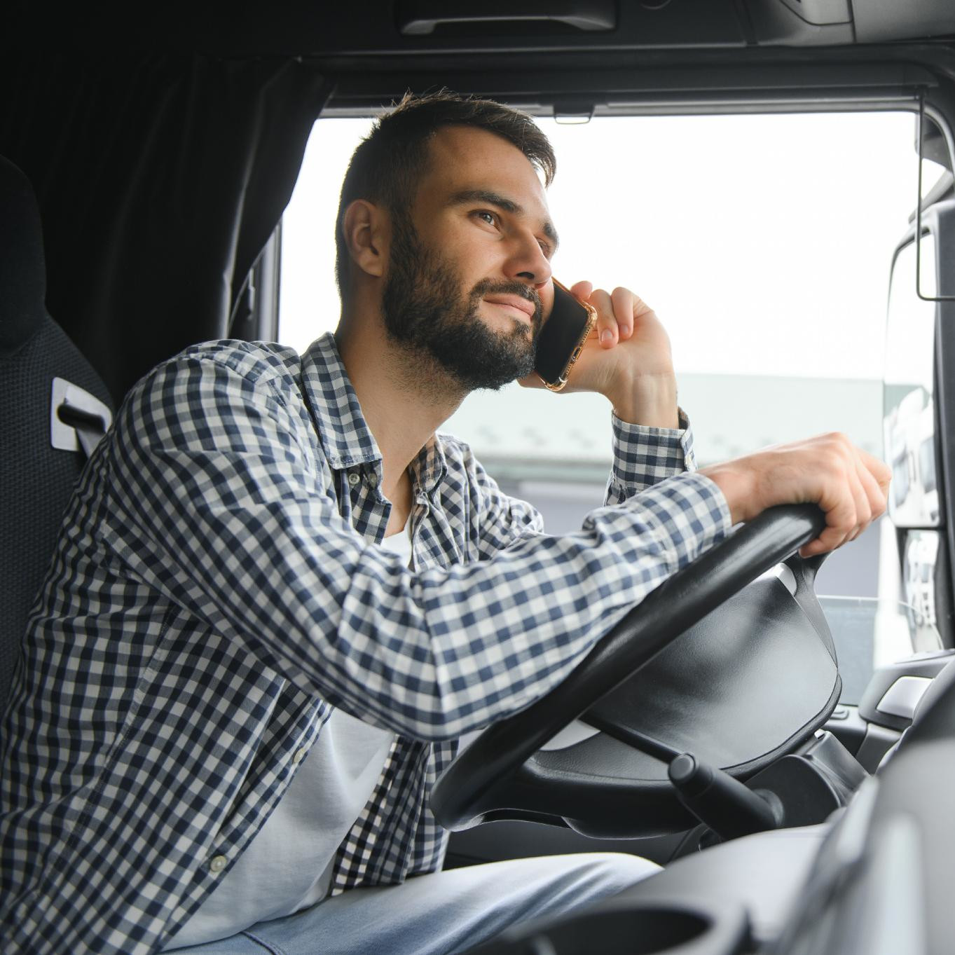 young-professional-driver-communicating-over-mobil-2025-03-17-22-16-31-square